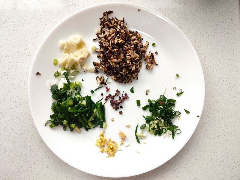 Finely chopped garlic, ginger, green onion, and mushrooms